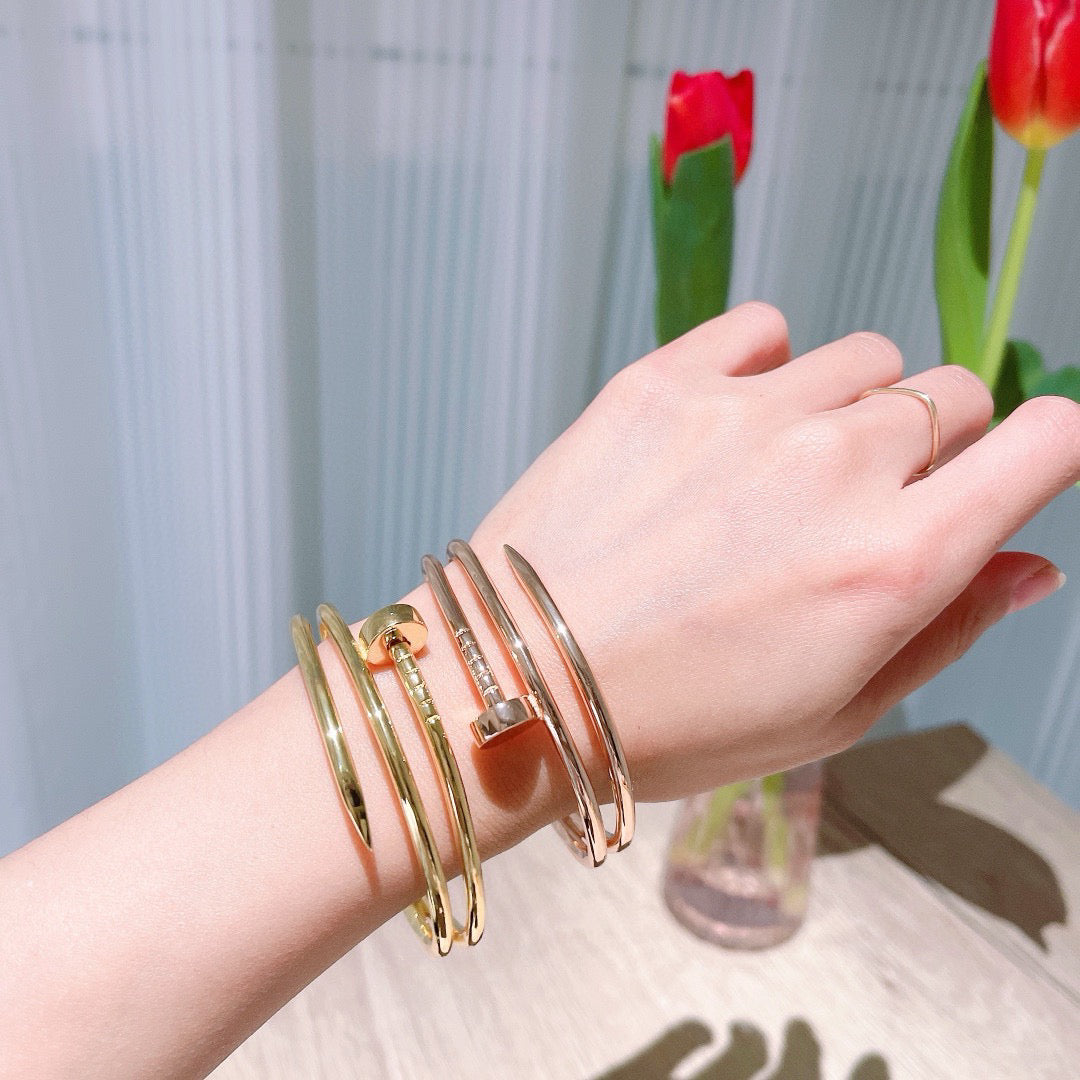 Avelora double-wrap nail bangles in three color finishes