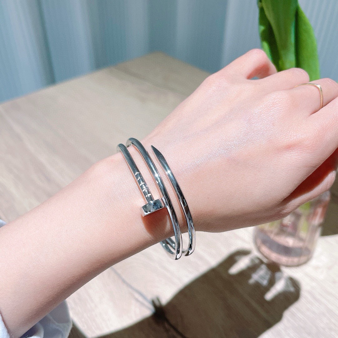 Avelora Silver double-wrap nail bangle worn on the wrist
