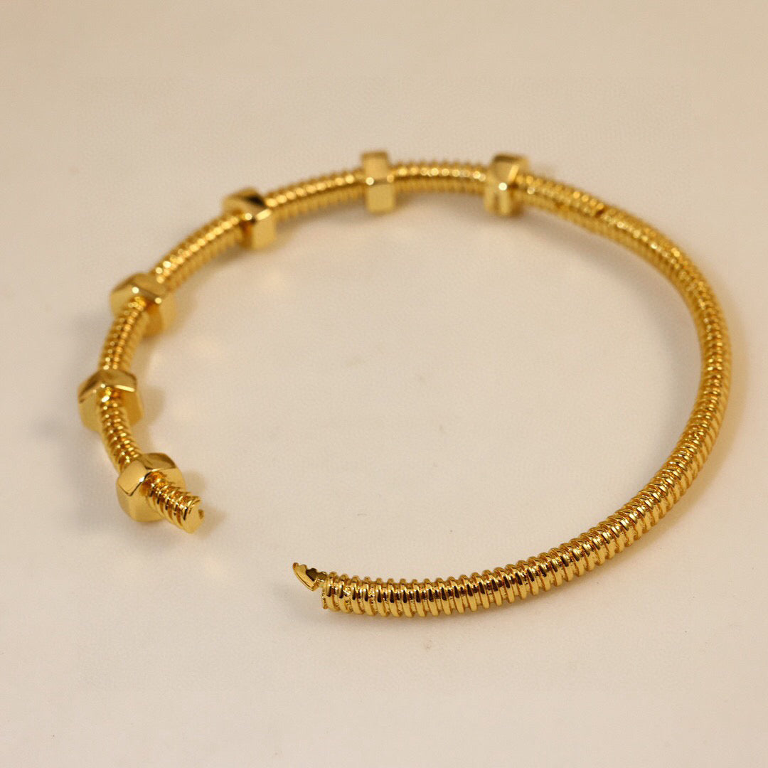 Gold flexible screw bangle with open clasp